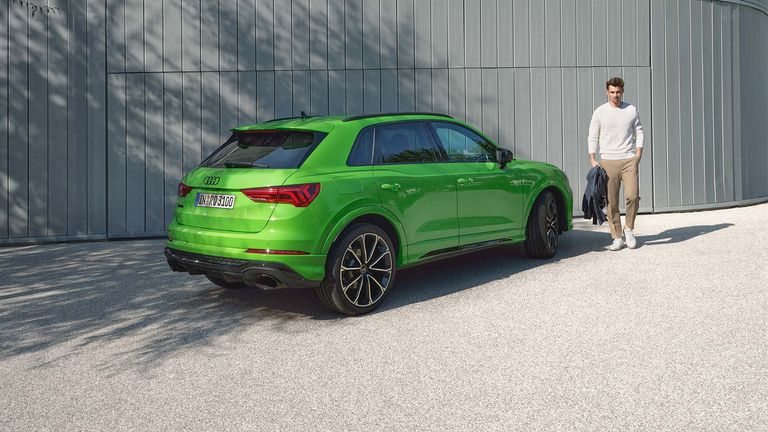 Audi RS Q3 side rear view with model on the side
